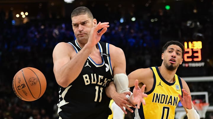 Apr 27, 2025; Milwaukee, Wisconsin, USA; Milwaukee Bucks center Brook Lopez (11) looks for a rebound against Indiana Pacers guard Tyrese Haliburton (0) in the first quarter during game four of first round for the 2024 NBA Playoffs at Fiserv Forum. Mandatory Credit: Benny Sieu-Imagn Images