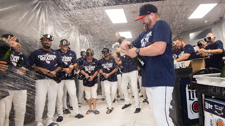 Sep 19, 2024; Cleveland, Ohio, USA; Cleveland Guardians manager Stephen Vogt, right, celebrates with his players after the Guardians beat the Minnesota Twins and clinched a playoff berth at Progressive Field. Mandatory Credit: Ken Blaze-Imagn Images