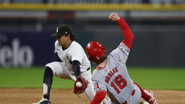Sep 24, 2024; Chicago, Illinois, USA; Los Angeles Angels outfielder Mickey Moniak (16) steals second base against Chicago White Sox second baseman Nicky Lopez (8) during the fifth inning at Guaranteed Rate Field. Mandatory Credit: Kamil Krzaczynski-Imagn Images