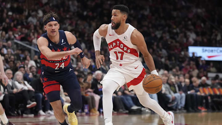 Mar 10, 2025; Toronto, Ontario, CAN; Toronto Raptors forward Garrett Temple (17) drives to the net against Washington Wizards guard Corey Kispert (24) during the second half at Scotiabank Arena. Mandatory Credit: John E. Sokolowski-Imagn Images