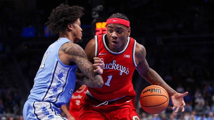 Dec 20, 2025; Atlanta, Georgia, USA; Ohio State Buckeyes forward Amare Bynum (1) is defended by North Carolina Tar Heels forward Jonathan Powell (11) in the first half at State Farm Arena. Mandatory Credit: Brett Davis-Imagn Images
