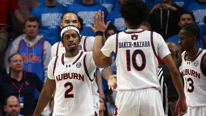 Feb 1, 2025; Oxford, Mississippi, USA; Auburn Tigers guard Denver Jones (2) reacts with forward Chad Baker-Mazara (10) during the second half against the Mississippi Rebels at The Sandy and John Black Pavilion at Ole Miss. Mandatory Credit: Petre Thomas-Imagn Images