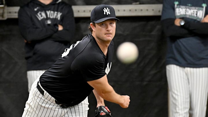 Feb 16, 2025; Tampa, FL, USA; New York Yankees pitcher Gerrit Cole (45)  throws a pitch during spring training at George M. Steinbrenner Field. Mandatory Credit: Jonathan Dyer-Imagn Images