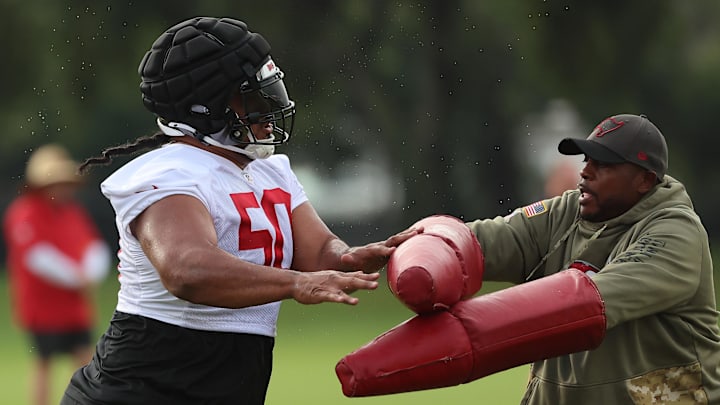 Jul 25, 2024; Tampa, FL, USA;  Tampa Bay Buccaneers defensive tackle Vita Vea (50) and defensive coordinator Kacy Rodgers during training camp at AdventHealth Training Center. Mandatory Credit: Kim Klement Neitzel-Imagn Images