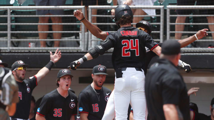 Georgia's Charlie Condon (24) celebrates with his teammate after hitting a home run during a NCAA Athens Regional baseball game against Army in Athens, Ga., on Friday, May 31, 2024. Georgia's Charlie Condon (24) celebrates with his teammate after hitting a home run during a NCAA Athens Regional baseball game against Army in Athens, Ga., on Friday, May 31, 2024.