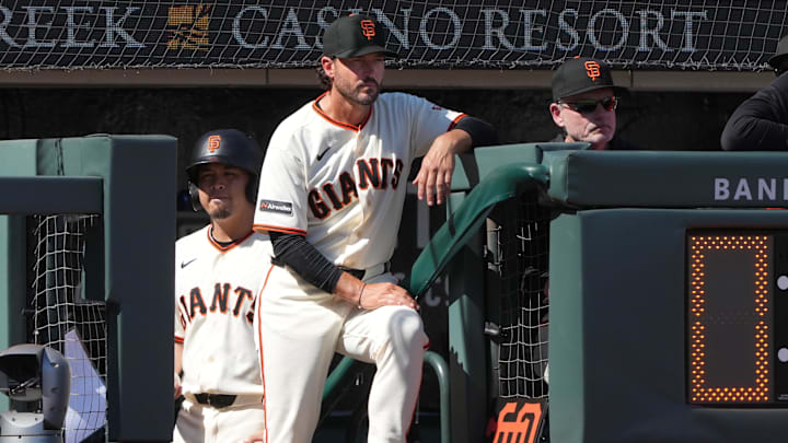 Mar 27, 2026; San Francisco, California, USA; San Francisco Giants manager Tony Vitello (center) stands in the dugout during the sixth inning against the New York Yankees at Oracle Park. Mandatory Credit: Darren Yamashita-Imagn Images