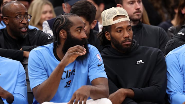 Los Angeles Clippers guard James Harden (1, left) and Kawhi Leonard (right) watch the game against the Utah Jazz from the bench during the fourth quarter at Intuit Dome. Los Angeles Clippers guard James Harden (1, left) and Kawhi Leonard (right) watch the game against the Utah Jazz from the bench during the fourth quarter at Intuit Dome.