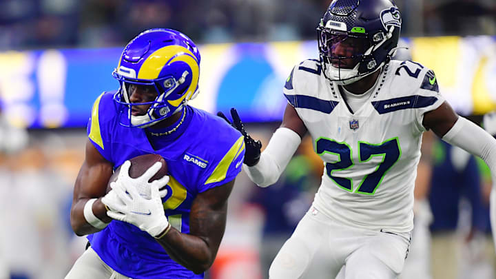 Dec 4, 2022; Inglewood, California, USA; Los Angeles Rams wide receiver Van Jefferson (12) runs the ball ahead of Seattle Seahawks cornerback Tariq Woolen (27) during the second half at SoFi Stadium. Dec 4, 2022; Inglewood, California, USA; Los Angeles Rams wide receiver Van Jefferson (12) runs the ball ahead of Seattle Seahawks cornerback Tariq Woolen (27) during the second half at SoFi Stadium.