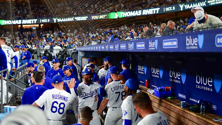 Aug 15, 2025; Los Angeles, California, USA; Los Angeles Dodgers right fielder Teoscar Hernandez (37) is greeted after hitting a solo home run against the San Diego Padres during the seventh inning at Dodger Stadium. Mandatory Credit: Gary A. Vasquez-Imagn Images