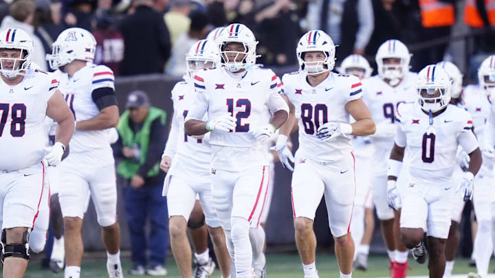 Nov 1, 2025; Boulder, Colorado, USA; Members of the Arizona Wildcats before the game against the Colorado Buffaloes at Folsom Field. Mandatory Credit: Ron Chenoy-Imagn Images