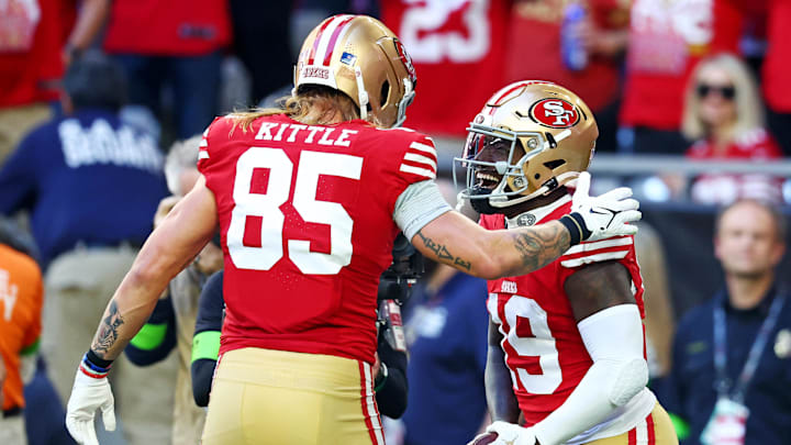 Dec 17, 2023; Glendale, Arizona, USA; San Francisco 49ers wide receiver Deebo Samuel (19) celebrates with San Francisco 49ers tight end George Kittle (85) after scoring a touchdown during the first quarter against the Arizona Cardinals at State Farm Stadium. Mandatory Credit: Mark J. Rebilas-Imagn Images