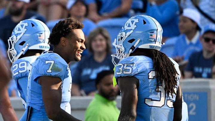 Sep 13, 2025; Chapel Hill, North Carolina, USA; North Carolina Tar Heels running back Demon June (35) celebrates with quarterback Gio Lopez (7) after scoring a touchdown in the fourth quarter at Kenan Stadium. 