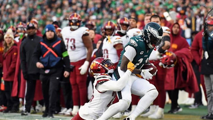 Jan 26, 2025; Philadelphia, PA, USA; Philadelphia Eagles wide receiver A.J. Brown (11) runs with the ball against Washington Commanders cornerback Marshon Lattimore (23) during the first half in the NFC Championship game at Lincoln Financial Field. Mandatory Credit: Eric Hartline-Imagn Images
