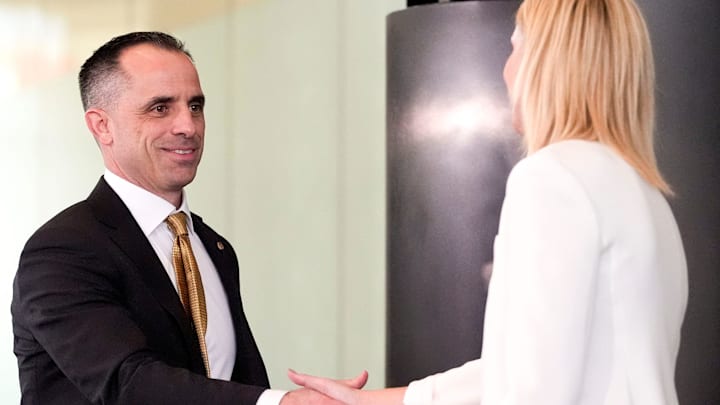 Ben McCollum shakes Iowa Athletic Director Beth Goetz' hand as he's introduced as the new Iowa men's basketball head coach Tuesday, March 25, 2025 at Carver-Hawkeye Arena in Iowa City, Iowa. Ben McCollum shakes Iowa Athletic Director Beth Goetz' hand as he's introduced as the new Iowa men's basketball head coach Tuesday, March 25, 2025 at Carver-Hawkeye Arena in Iowa City, Iowa.