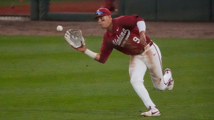 Feb 14, 2025; Tuscaloosa, AL, USA; Right fielder Bryce Fowler rushes in to snag a sinking line drive during Alabama baseball’s opening day at Sewell-Thomas Stadium against Bradley. The Crimson Tide defeated Bradley 10-6.