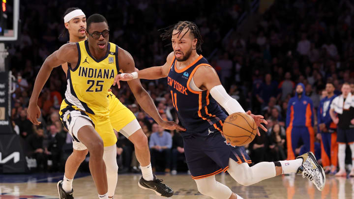 Feb 1, 2024; New York, New York, USA; New York Knicks guard Jalen Brunson (11) drives around Indiana Pacers forward Jalen Smith (25) and guard Andrew Nembhard (2) during the fourth quarter at Madison Square Garden. Mandatory Credit: Brad Penner-USA TODAY Sports