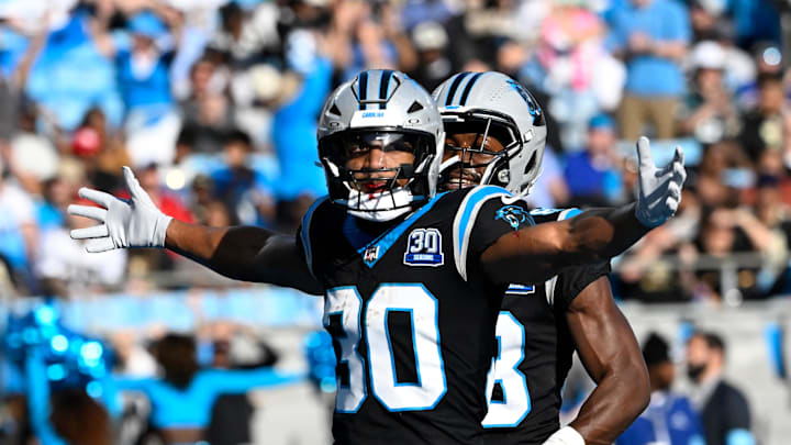 Nov 3, 2024; Charlotte, North Carolina, USA; Carolina Panthers running back Chuba Hubbard (30) celebrates touchdown in the third qarter at Bank of America Stadium. Mandatory Credit: Bob Donnan-Imagn Images