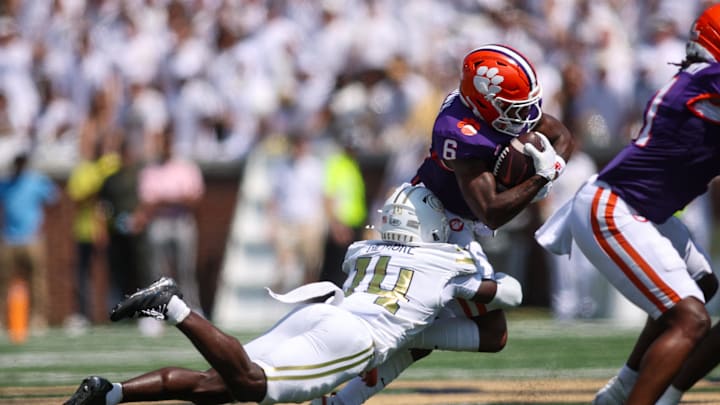 Sep 13, 2025; Atlanta, Georgia, USA; Clemson Tigers wide receiver Tyler Brown (6) is tackled by Georgia Tech Yellow Jackets defensive back Jy Gilmore (14) in the first quarter at Bobby Dodd Stadium at Hyundai Field. Mandatory Credit: Brett Davis-Imagn Images
