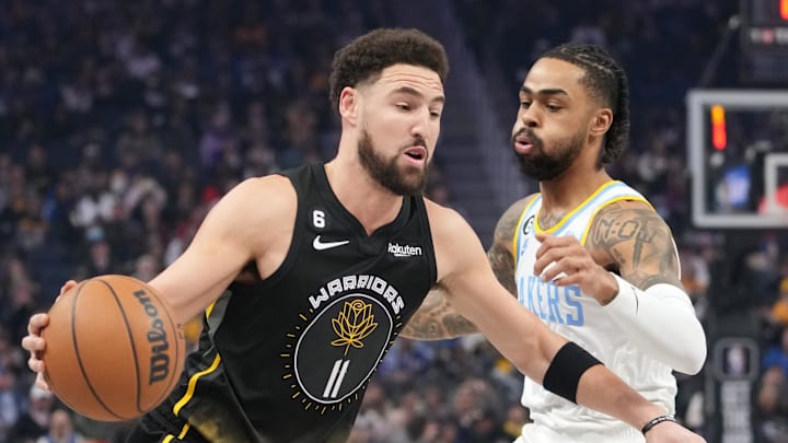February 11, 2023; San Francisco, California, USA; Golden State Warriors guard Klay Thompson (11) dribbles the basketball against Los Angeles Lakers guard D'Angelo Russell (1) during the first quarter at Chase Center. Mandatory Credit: Kyle Terada-Imagn Images February 11, 2023; San Francisco, California, USA; Golden State Warriors guard Klay Thompson (11) dribbles the basketball against Los Angeles Lakers guard D'Angelo Russell (1) during the first quarter at Chase Center. Mandatory Credit: Kyle Terada-Imagn Images