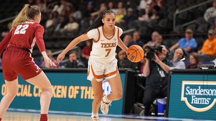 Mar 6, 2026; Greenville, SC, USA; Texas Longhorns guard Jordan Lee (7) brings the ball up court against Alabama Crimson Tide guard Karly Weathers (22) during the second half at Bon Secours Wellness Arena. Mandatory Credit: Jim Dedmon-Imagn Images