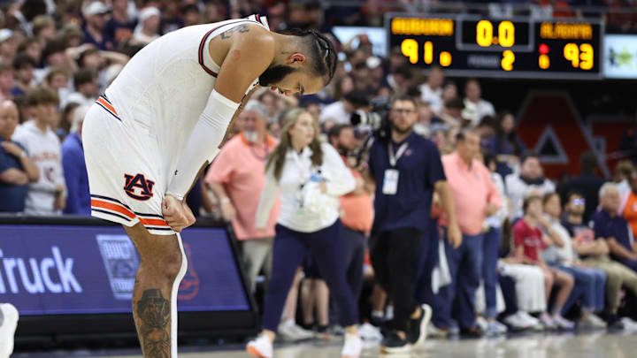 Mar 8, 2025; Auburn, Alabama, USA; Auburn Tigers forward Johni Broome (4) reacts after the Crimson Tide beat the Auburn Tigers in overtime at Neville Arena. Mandatory Credit: John Reed-Imagn Images