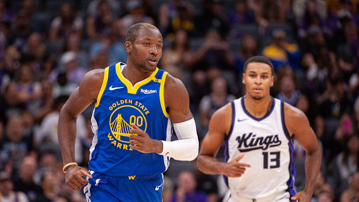 Oct 9, 2024; Sacramento, California, USA; Golden State Warriors forward Jonathan Kuminga (00) and Sacramento Kings forward Keegan Murray (13) jog up the court during the first quarter at Golden 1 Center. Mandatory Credit: Ed Szczepanski-Imagn Images