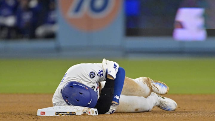 Los Angeles Dodgers designated hitter Shohei Ohtani (17) reacts at second base after an apparent injury in the seventh inning against the New York Yankees during game two of the 2024 MLB World Series at Dodger Stadium on Oct. 26. Los Angeles Dodgers designated hitter Shohei Ohtani (17) reacts at second base after an apparent injury in the seventh inning against the New York Yankees during game two of the 2024 MLB World Series at Dodger Stadium on Oct. 26.
