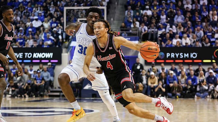 Feb 7, 2026; Provo, Utah, USA; Houston Cougars guard Kingston Flemings (4) drives during the second half against the BYU Cougars at Marriott Center. Mandatory Credit: Aaron Baker-Imagn Images