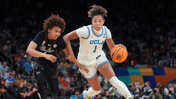 UCLA Bruins guard Kiki Rice (1) drives past South Carolina Gamecocks guard Maddy McDaniel (1) during the NCAA women's basketball national championship at Mortgage Matchup Center in Phoenix on April 5, 2026.