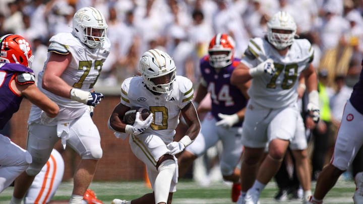 Sep 13, 2025; Atlanta, Georgia, USA; Georgia Tech Yellow Jackets running back Malachi Hosley (0) runs the ball against the Clemson Tigers in the second quarter at Bobby Dodd Stadium at Hyundai Field. Mandatory Credit: Brett Davis-Imagn Images