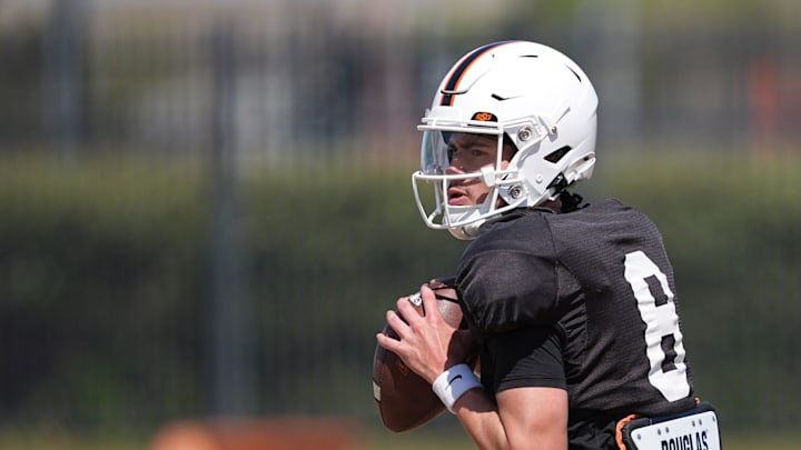 Oklahoma State's Maealiuaki Smith looks to throw a pas during a Spring football practice at Oklahoma State University in Stillwater, Okla., Tuesday, April, 8, 2025.
