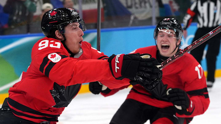Feb 18, 2026; Milan, Italy; Mitch Marner of Canada celebrates with Macklin Celebrini after scoring their fourth goal in overtime to win the match against Czechia in a men's ice hockey quarterfinal during the Milano Cortina 2026 Olympic Winter Games at Milano Santagiulia Ice Hockey Arena. Mandatory Credit: Amber Searls-Imagn Images Feb 18, 2026; Milan, Italy; Mitch Marner of Canada celebrates with Macklin Celebrini after scoring their fourth goal in overtime to win the match against Czechia in a men's ice hockey quarterfinal during the Milano Cortina 2026 Olympic Winter Games at Milano Santagiulia Ice Hockey Arena. Mandatory Credit: Amber Searls-Imagn Images