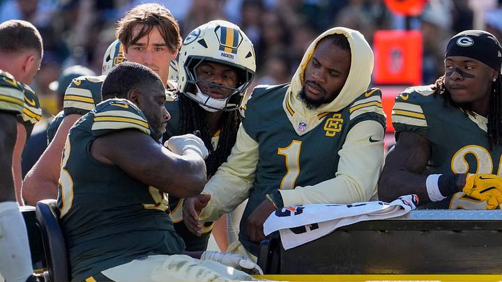Green Bay Packers defensive end Micah Parsons (1) checks on defensive tackle Javon Hargrave (98) Green Bay Packers defensive end Micah Parsons (1) checks on defensive tackle Javon Hargrave (98)
