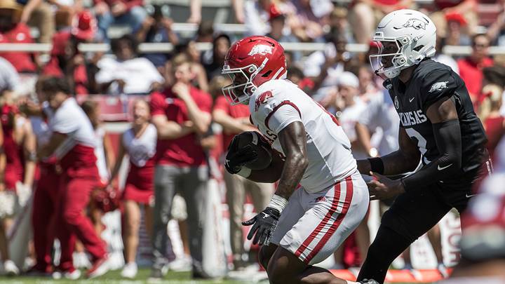 Apr 25, 2026; Fayetteville, AR, USA; Arkansas Razorbacks running back Braylen Russell (0) takes a handoff from quarterback AJ Hill (2) during the spring game at Donald W. Reynolds Razorback Stadium. Mandatory Credit: Brett Rojo-Imagn Images