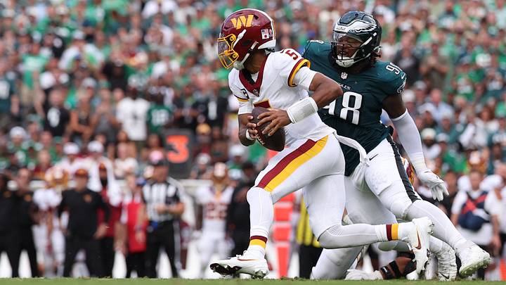 Sep 13, 2026; Philadelphia, Pennsylvania, USA;  Philadelphia Eagles defensive tackle Jalen Carter (98) rushes Washington Commanders quarterback Jayden Daniels (5) during the first half at Lincoln Financial Field.  Mandatory Credit: Bill Streicher-Imagn Images