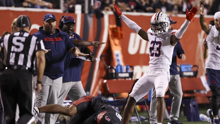 Sep 28, 2024; Salt Lake City, Utah, USA; Arizona Wildcats defensive back Emmanuel Karnley (23) reacts after breaking up a pass intended for Utah Utes wide receiver Dorian Singer (3) during the second quarter at Rice-Eccles Stadium. Mandatory Credit: Rob Gray-Imagn Images