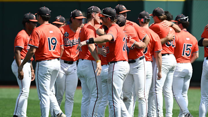 Jun 16, 2024; Omaha, NE, USA;  The Virginia Cavaliers meet on the field after the loss against the Florida State Seminoles at Charles Schwab Field Omaha. Mandatory Credit: Steven Branscombe-Imagn Images