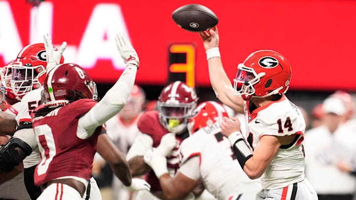 Dec 6, 2025; Atlanta, GA, USA; Georgia Bulldogs quarterback Gunner Stockton (14) throws a pass during the first quarter against the Alabama Crimson Tide during the 2025 SEC Championship game at Mercedes-Benz Stadium. Mandatory Credit: Dale Zanine-Imagn Images