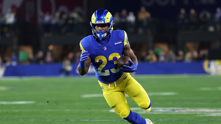 Los Angeles Rams running back Kyren Williams (23) rushes the ball against the Minnesota Vikings during the first half in an NFC wild card game at State Farm Stadium. 