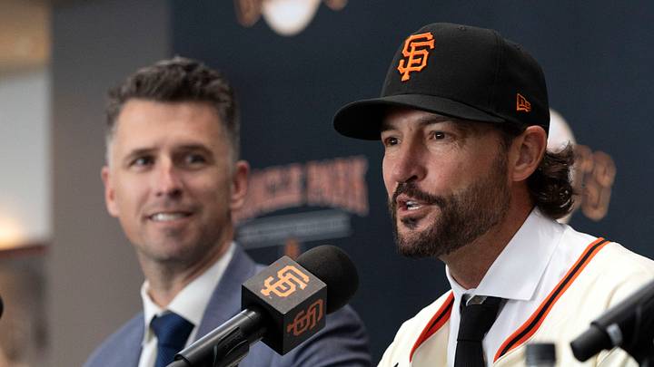 San Francisco, CA, USA;  Tony Vitello (center) answers questions from the media as he is introduced as the new manager of the San Francisco Giants at Oracle Park. He is flanked by president of baseball operations Buster Posey (left) and general manager Zack Minasian. Mandatory Credit: D. Ross Cameron-Imagn Images