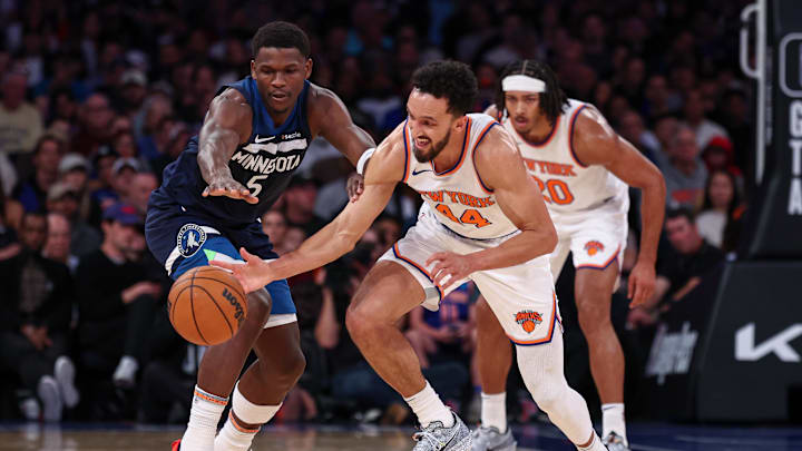 Oct 13, 2024; New York, New York, USA; New York Knicks guard Landry Shamet (44) steals the ball from Minnesota Timberwolves guard Anthony Edwards (5) during the first half at Madison Square Garden. Mandatory Credit: Vincent Carchietta-Imagn Images