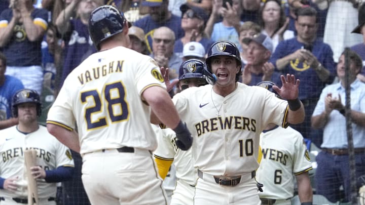 Andrew Vaughn is greeted by Sal Frelick (10) after hitting a home run vs. the Dodgers
