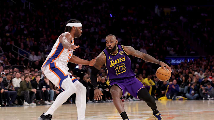 Feb 1, 2025; New York, New York, USA; Los Angeles Lakers forward LeBron James (23) controls the ball against New York Knicks forward Precious Achiuwa (5) during the third quarter at Madison Square Garden. Mandatory Credit: Brad Penner-Imagn Images Feb 1, 2025; New York, New York, USA; Los Angeles Lakers forward LeBron James (23) controls the ball against New York Knicks forward Precious Achiuwa (5) during the third quarter at Madison Square Garden. Mandatory Credit: Brad Penner-Imagn Images