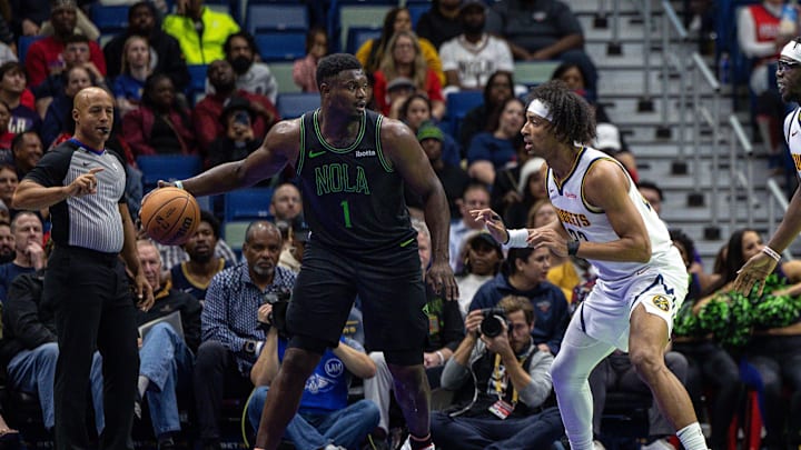 Nov 17, 2023; New Orleans, Louisiana, USA; New Orleans Pelicans forward Zion Williamson (1) dribbles against Denver Nuggets forward Zeke Nnaji (22) during the first half at the Smoothie King Center. Mandatory Credit: Stephen Lew-Imagn Images Nov 17, 2023; New Orleans, Louisiana, USA; New Orleans Pelicans forward Zion Williamson (1) dribbles against Denver Nuggets forward Zeke Nnaji (22) during the first half at the Smoothie King Center. Mandatory Credit: Stephen Lew-Imagn Images