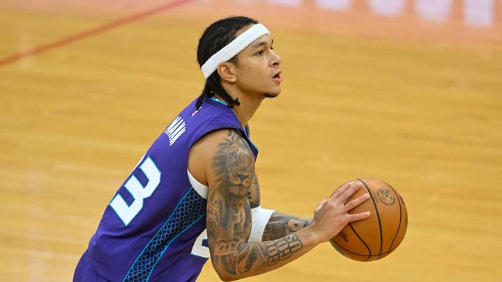 Dec 22, 2025; Cleveland, Ohio, USA; Charlotte Hornets guard Tre Mann (23) shoots in the third quarter against the Cleveland Cavaliers at Rocket Arena. Mandatory Credit: David Richard-Imagn Images