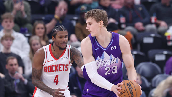 Feb 22, 2025; Salt Lake City, Utah, USA; Utah Jazz forward Lauri Markkanen (23) posts up against Houston Rockets guard Jalen Green (4) during the second half at Delta Center. Mandatory Credit: Rob Gray-Imagn Images