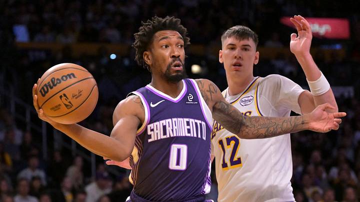 Dec 28, 2025; Los Angeles, California, USA; Sacramento Kings guard Malik Monk (0) gets past Los Angeles Lakers forward Jake Laravia (12) to make a pass in the first half at Crypto.com Arena. Mandatory Credit: Jayne Kamin-Oncea-Imagn Images Dec 28, 2025; Los Angeles, California, USA; Sacramento Kings guard Malik Monk (0) gets past Los Angeles Lakers forward Jake Laravia (12) to make a pass in the first half at Crypto.com Arena. Mandatory Credit: Jayne Kamin-Oncea-Imagn Images
