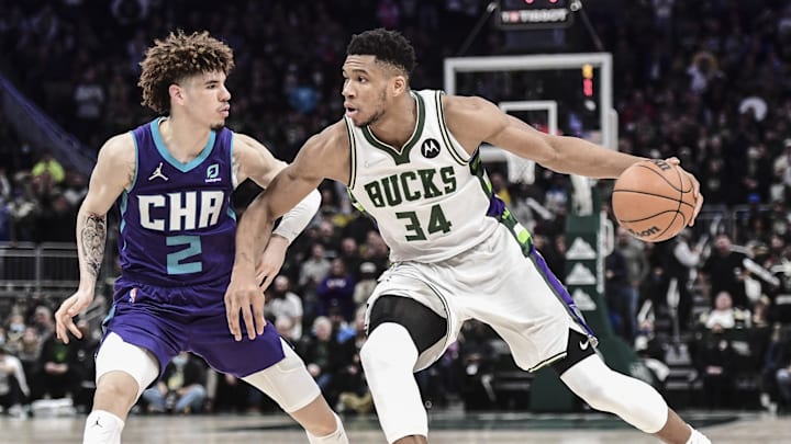 Dec 1, 2021; Milwaukee, Wisconsin, USA;  Milwaukee Bucks forward Giannis Antetokounmpo (34) drives for the basket against Charlotte Hornets guard LaMelo Ball (2) in the fourth quarter at Fiserv Forum. Mandatory Credit: Benny Sieu-Imagn Images