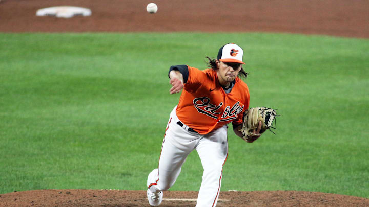 Aug 7, 2021; Baltimore, Maryland, USA; Baltimore Orioles relief pitcher Isaac Mattson (60) throws against the Tampa Bay Rays durning the ninth inning at Oriole Park at Camden Yards. Mandatory Credit: Daniel Kucin Jr.-Imagn Images