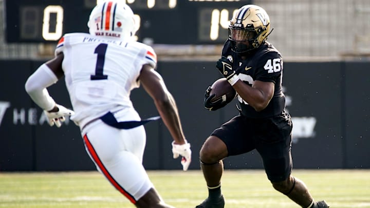 Vanderbilt running back AJ Newberry (46) runs the ball towards Auburn cornerback Nehemiah Pritchett